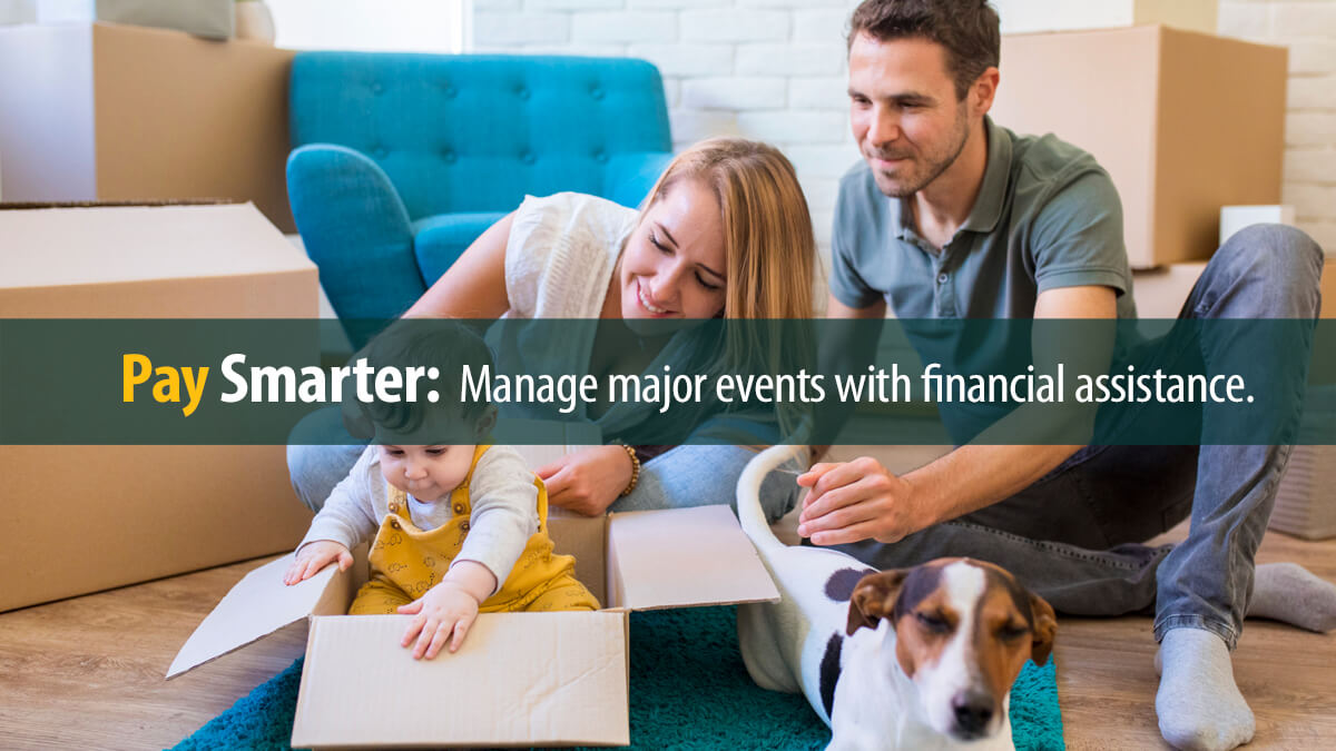 A portrait of young family with a toddler girl and a pet dog moving in new home